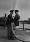 Harbour Firemen with hose